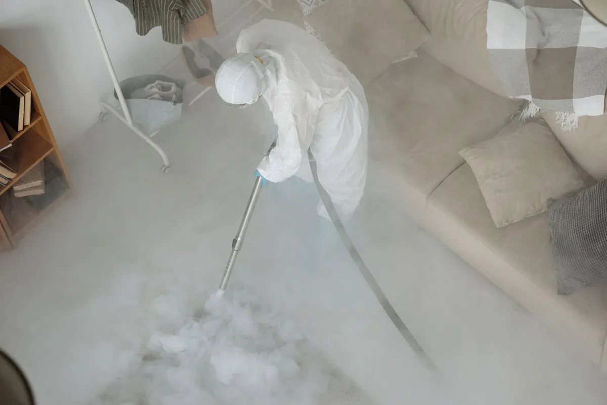 Biohazard cleanup technician in protective equipment, The Hills, NJ